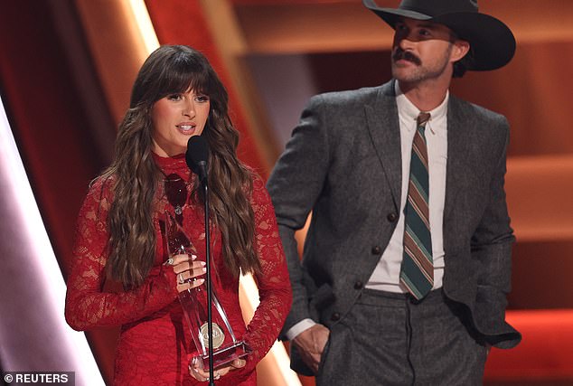 Ella Langley and Riley Green celebrate winning Single of the Year for 'you look like you love me' at the CMA Awards