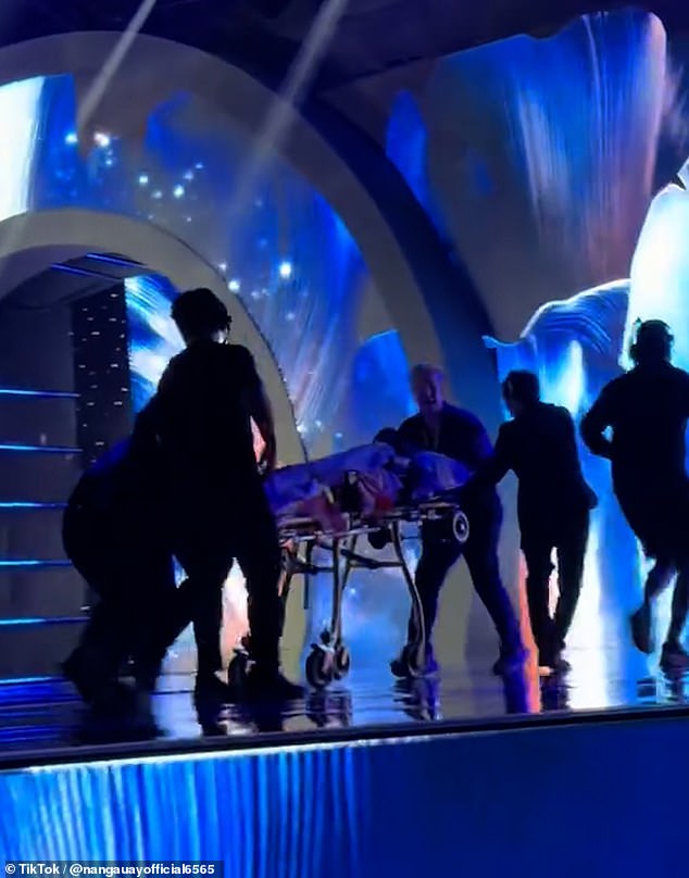 Gabrielle Henry being carried away on a stretcher after her fall during the Miss Universe preliminary competition.