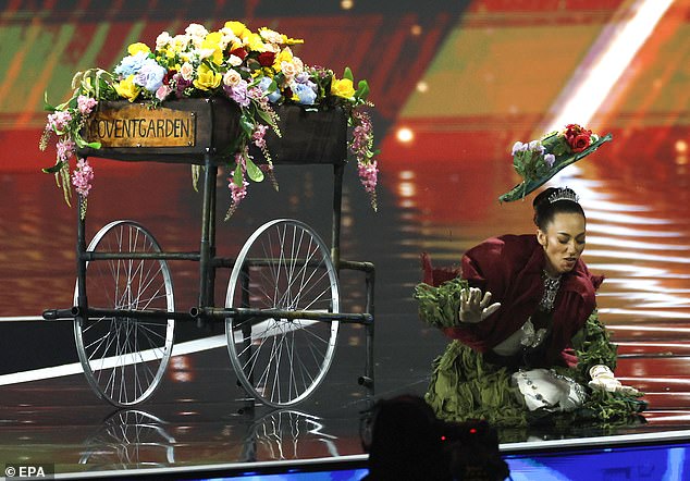Miss Great Britain Danielle Latimer enters in an Eliza Doolittle–inspired look during the Miss Universe 2025 national costume show in Thailand