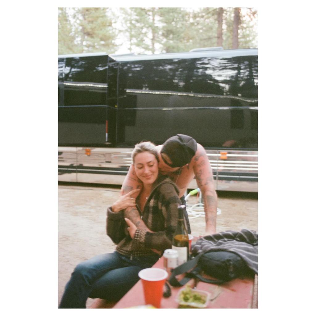 Samantha Leonard and Zach Bryan in an embrace.